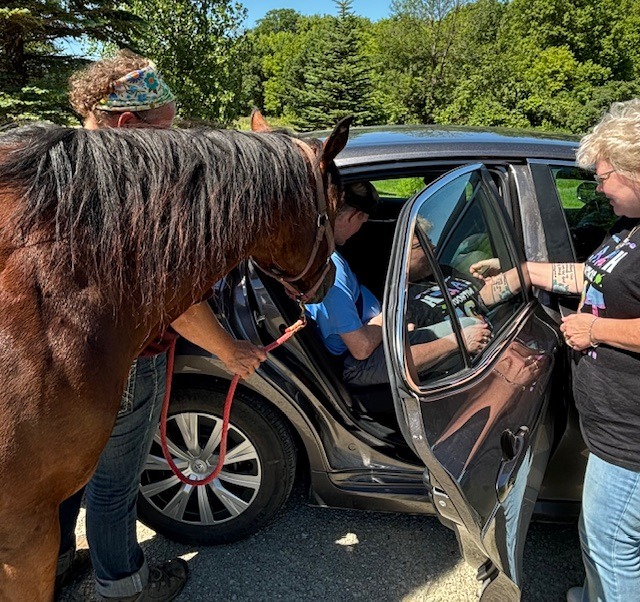 Baylee visiting with a drive-up participant.