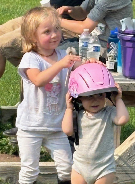 The helmet is a bit big so she won't be riding very soon ... at least until she is out of diapers!