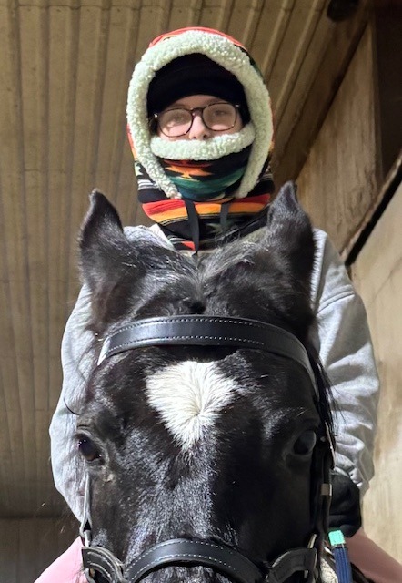 Appropriate Winter Wear ... yes, she is wearing a helmet under that hood!