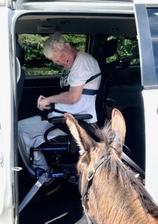Hank visiting with a drive up visitor.